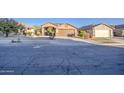 House exterior view showcasing front yard and street at 1633 S 171St Dr, Goodyear, AZ 85338