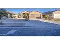 Front view of house with driveway and sidewalk at 1633 S 171St Dr, Goodyear, AZ 85338