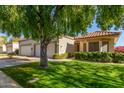 House exterior showcasing a well-manicured lawn and driveway at 18881 N 91St Dr, Peoria, AZ 85382