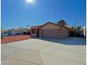 House exterior with a large driveway, solar panels and landscaping at 19624 N 16Th Dr, Phoenix, AZ 85027