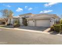 Spacious home with a three-car garage and mature landscaping at 2181 W Thompson Pl, Chandler, AZ 85286