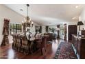 Elegant dining room with hardwood floors, a chandelier, and a formal dining table at 2336 Leisure World --, Mesa, AZ 85206