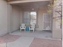 Inviting front porch with seating area, neutral paint, and decorative door accents at 2355 N Cabot --, Mesa, AZ 85207