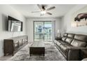 Spacious living area with sliding glass doors leading to a private balcony at 2511 W Queen Creek Rd # 415, Chandler, AZ 85248