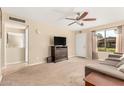 Bright living room featuring a comfy couch and large TV at 2526 N 22Nd Dr, Phoenix, AZ 85009