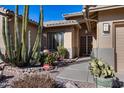 Front entry with security system and desert landscaping at 26646 N 46Th Pl, Cave Creek, AZ 85331