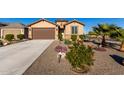 House exterior with desert landscaping and driveway at 27606 W Tonopah Dr, Buckeye, AZ 85396