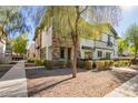 Modern townhome with walkway and landscaping at 2780 S Equestrian Dr # 102, Gilbert, AZ 85295