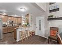 Open concept kitchen with breakfast bar and hardwood floors at 3036 W Gail Rd, Phoenix, AZ 85029