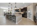 Modern kitchen featuring an island and stainless steel appliances at 4552 S Flare --, Mesa, AZ 85212