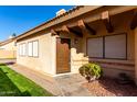 Attractive front entry with a wooden door and landscaping at 4698 W Harrison St, Chandler, AZ 85226