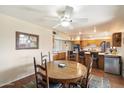 Round dining table with wooden chairs, adjacent to kitchen at 6437 E Cypress St, Scottsdale, AZ 85257