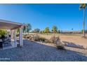 Covered patio with furniture and golf course view at 8732 W Rockwood Dr, Peoria, AZ 85382