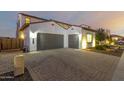 Spacious three-car garage with paver driveway at 9430 W Jj Ranch Rd, Peoria, AZ 85383