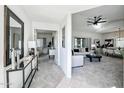 Inviting entryway with mirror and console table, offering a glimpse into the living area at 9455 E Raintree Dr # 2049, Scottsdale, AZ 85260