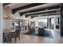 Spacious living room with hardwood floors, exposed beams, and stunning mountain views at 10040 E Happy Valley Rd # 1041, Scottsdale, AZ 85255