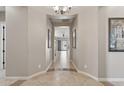 Elegant entryway with tile flooring and artwork at 10062 W Redbird Rd, Peoria, AZ 85383