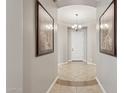 Bright entryway with tile flooring and white door at 10062 W Redbird Rd, Peoria, AZ 85383