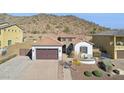 Stunning home exterior with two-car garage at 10062 W Redbird Rd, Peoria, AZ 85383