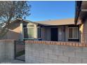 Brick home with a gated entrance and well-maintained landscaping at 10138 W Highland Ave, Phoenix, AZ 85037