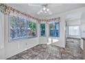 Bright breakfast nook with tile flooring and bay window at 10634 W Mohawk Ln, Peoria, AZ 85382