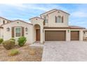 Two-story home with Spanish-style architecture and a three-car garage at 11667 W Marguerite Ave, Avondale, AZ 85323