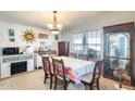 Bright dining area with floral tablecloth and wooden table set at 120 N Val Vista Dr # 186, Mesa, AZ 85213