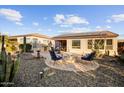 Outdoor patio area with fire pit and built-in BBQ at 12979 W Roy Rogers Rd, Peoria, AZ 85383