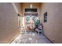 Inviting entryway with double doors and southwestern decor at 16364 W Roosevelt St, Goodyear, AZ 85338