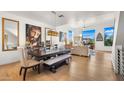 Elegant dining room with dark wood table and bench at 16510 N 92Nd St # 1006, Scottsdale, AZ 85260