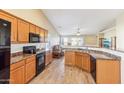 Eat-in kitchen with wood cabinets and granite countertops at 19339 N Madison Rd, Maricopa, AZ 85139