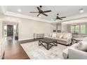 Bright living room featuring hardwood floors and a neutral color palette at 20543 E Excelsior Ct, Queen Creek, AZ 85142