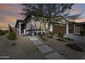 Single-story home with a two-car garage and lighted walkway at 2156 W Sierra Sunset Trl, Phoenix, AZ 85085