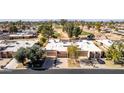 Aerial view of homes near a golf course at 25244 S Saddletree Dr, Sun Lakes, AZ 85248