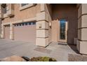 House entrance with double garage and decorative door at 2734 E Birchwood Pl, Chandler, AZ 85249