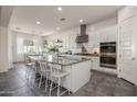 Spacious kitchen with granite counters, stainless appliances, and large island at 4747 S Aileron Ln, Mesa, AZ 85212