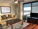 Spacious living room featuring hardwood floors and large windows at 4808 N 24Th St # 824, Phoenix, AZ 85016
