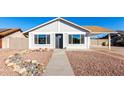 Newly renovated single story home with a rock garden and walkway at 6022 W Mauna Loa Ln, Glendale, AZ 85306