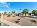 Front view of brick house with landscaping at 6235 E Larkspur Dr, Scottsdale, AZ 85254