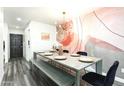 Contemporary dining area featuring a grey table and black velvet chairs at 7416 E Holly St, Scottsdale, AZ 85257