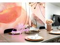 Elegant dining area with a stylish table setting and modern light fixture at 7416 E Holly St, Scottsdale, AZ 85257