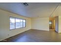 Living room featuring hardwood floors and large window at 816 S Esperanza Ave, Mesa, AZ 85208