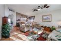 Bright living room featuring hardwood floors and comfortable seating at 9818 W Mohawk Ln, Peoria, AZ 85382