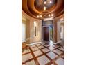 Elegant entryway with hardwood floors and decorative tile at 9887 E Edgestone Dr, Scottsdale, AZ 85255