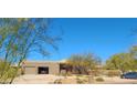 House exterior with two-car garage and desert landscaping at 10400 E Breathless Ave, Gold Canyon, AZ 85118