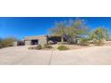 One-story home with stucco exterior and a circular driveway at 10400 E Breathless Ave, Gold Canyon, AZ 85118