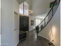 Bright and spacious entryway with modern staircase and high ceilings at 12312 E Poinsettia Dr, Scottsdale, AZ 85259