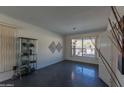 Bright spare bedroom with large window and access to backyard at 12312 E Poinsettia Dr, Scottsdale, AZ 85259