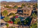 Luxury home with a large backyard and pool at 13428 S 186Th Ave, Goodyear, AZ 85338