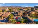 Aerial view of a beautiful home with a pool and mountain views at 13428 S 186Th Ave, Goodyear, AZ 85338